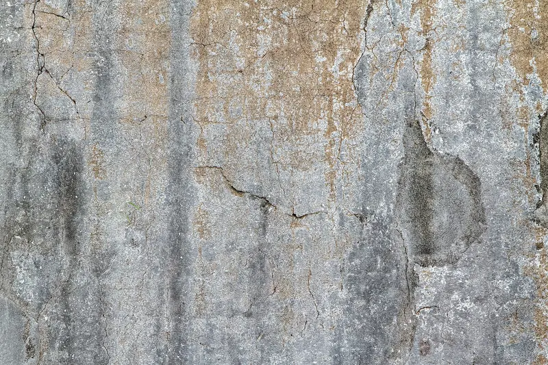 Brown water staining running down a concrete wall